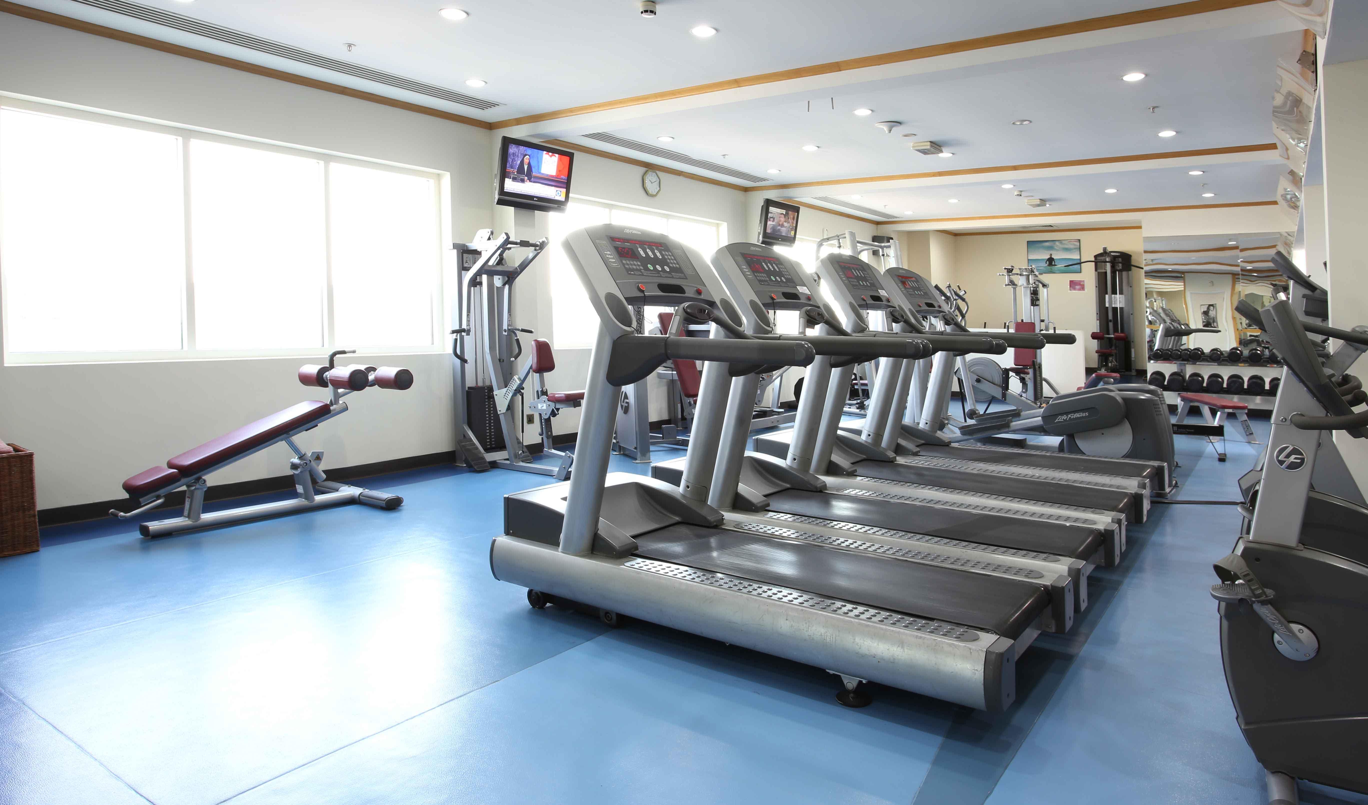 Knight Castle Hotel Dubai Exterior photo A row of treadmills