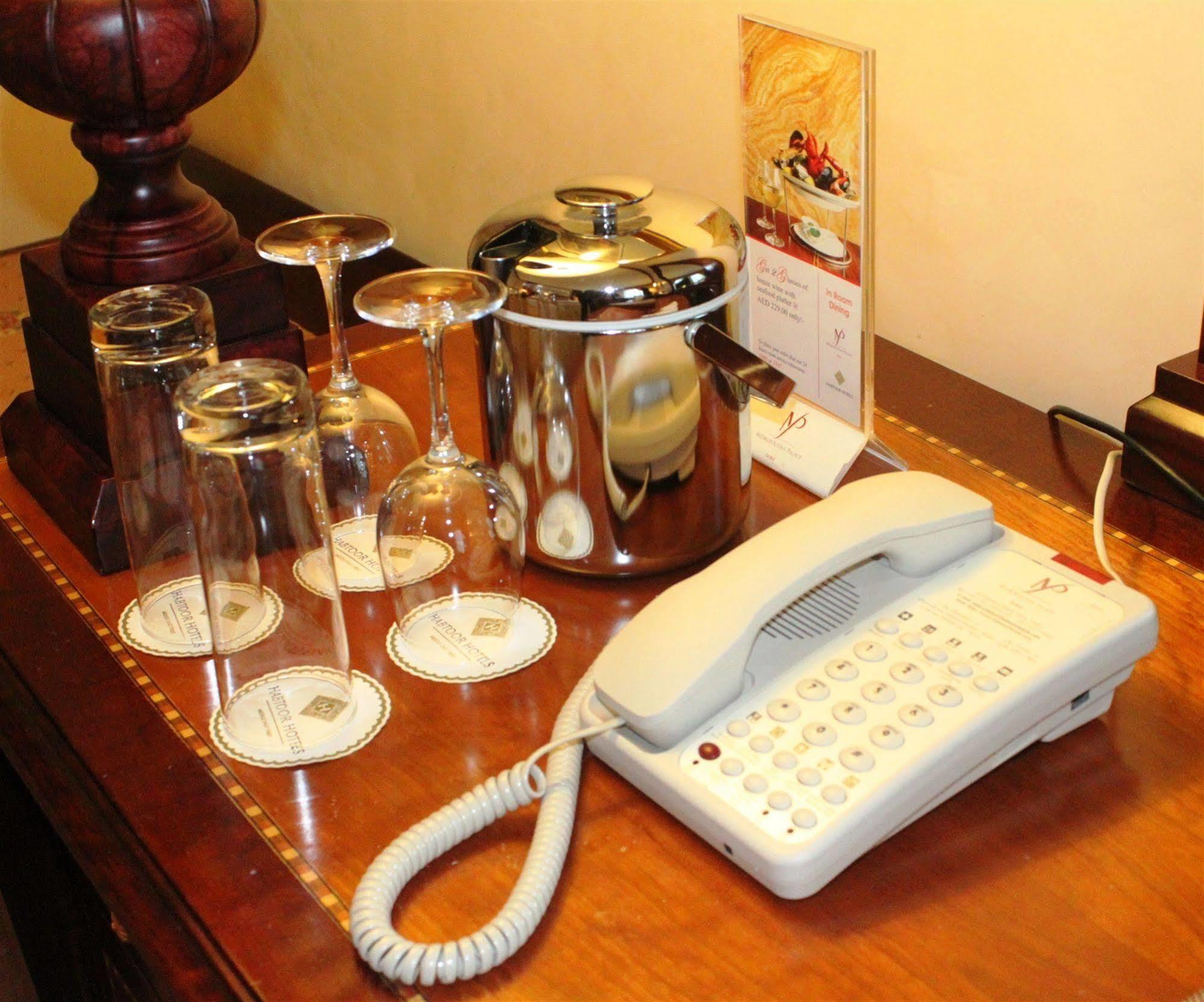 Knight Castle Hotel Dubai Exterior photo A telephone in a hotel room